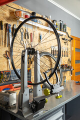 Bicycle wheel tuning station in workshop