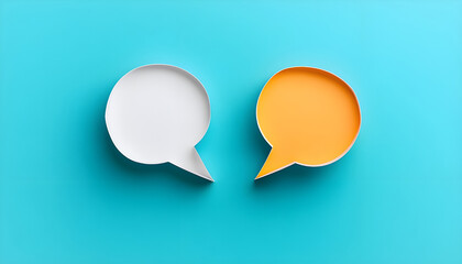 Two blank color paper speech bubbles for your design. White and orange dialogs on blue background. Flat lay top view, discussion template