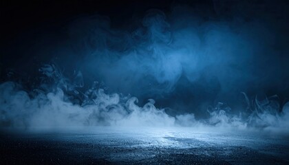 Fototapeta premium Wispy blue smoke billows across a dark textured ground with dramatic lighting