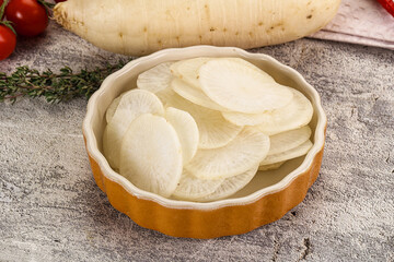 Sliced white daikon radish in the bowl