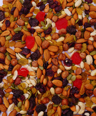 A mix of dried nuts and raisins with candied fruits.