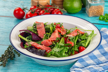 Salad with salmon and arugula