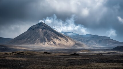 Volcanic landscape with a smoking peak under dramatic cloudy skies