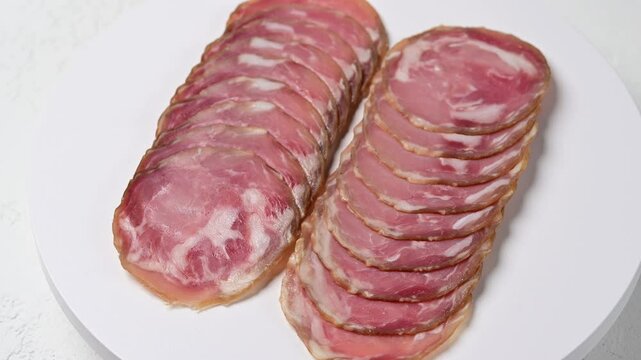 Artisanal italian coppa capocollo charcuterie: sliced cured pork perfection