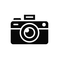 Simple black and white icon of a vintage camera with a lens and flash