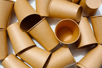 Brown paper cups on white background.