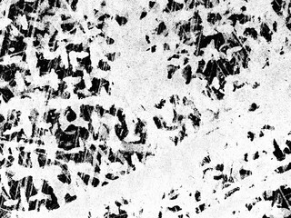 Black and white textured patterns created by scratching on a surface in an artistic exploration