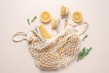 Zero waste home cleaning supplies, lemon and rosemary for making sustainable cleaning essentials on...
