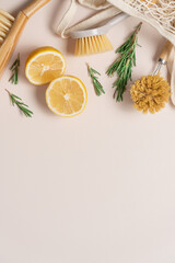 Zero waste home cleaning supplies, lemon and rosemary for making sustainable cleaning essentials on...