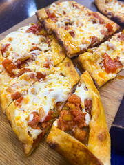 Traditional local Turkish flat bread pizza, Pide with meat, spices and cheese - Turkish dinner 