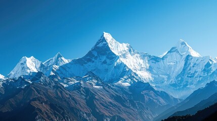 Obraz premium Snow-capped mountains with clear blue sky stock photo --ar 16:9 --raw --v 6 Job ID: 2f5e2220-3266-4a6a-813a-736042f2bb9a