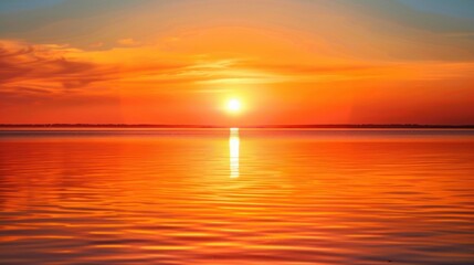 Fototapeta premium Beautiful orange sunset over calm water stock photo --ar 16:9 --raw --v 6 Job ID: c4eba837-d9c6-4993-98e5-775d52d9a2de
