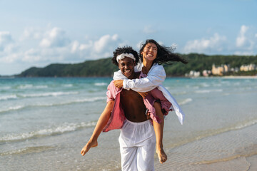 Interracial couple enjoying a romantic beach getaway, embracing love, laughter, and togetherness