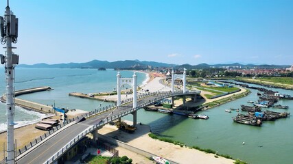 Discover the beauty of jinshi bridge at dalian jinshitan national tourist resort during bright summer day