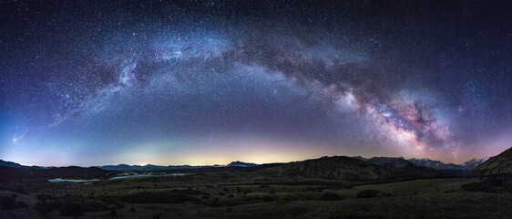 The Milky Way galaxy stretches across the night sky, revealing countless stars and cosmic wonders in a breathtaking celestial display.