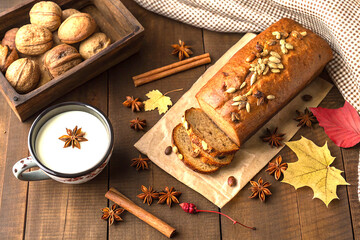 Warm autumn bread and spices on rustic wood with cozy seasonal vibes