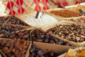 Dried fruit on sale at outdoor farmer market. The fruit shrinks during this process, leaving a...