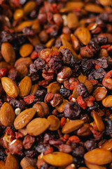 Dried fruit on sale at outdoor farmer market. The fruit shrinks during this process, leaving a...