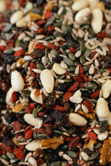 Dried fruit on sale at outdoor farmer market. The fruit shrinks during this process, leaving a...
