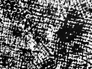 Abstract monochrome texture created through bold brush strokes on canvas evokes a sense of dynamic...