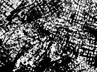 Abstract black and white texture showcasing dynamic patterns created by ink and brush techniques...