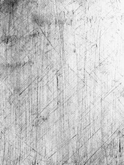 Textures of an old scratched surface with intricate lines and patterns captured in monochrome