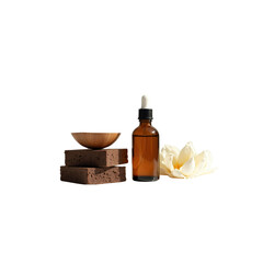 Amber Glass Dropper Bottle of Essential Oil with Wooden Bowl and Sponges, Spa Setting