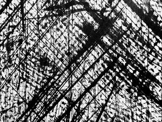 Abstract black and white artwork features intersecting lines and textures on canvas in an artistic...