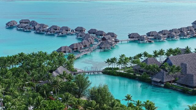 Bora Bora, French Polynesia. Drone View of Overwater Bungalows in Turquoise Lagoon Water