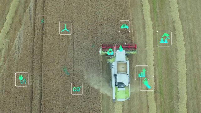 Combine entering frame cutting wheat while icons shifting to illustrate sustainability metrics