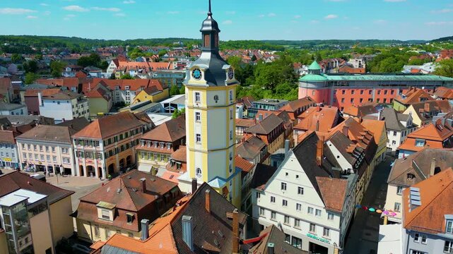 4K Aerial Drone Video of the Historic Herrieder Clock Tower in the Old Town area of Downtown Ansbach, Germany