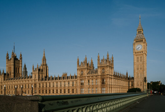 Houses of Parliament with Big Ben from bridge in London. England.