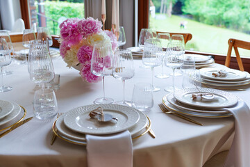 An elegantly decorated banquet table at an event. Wedding decoration.