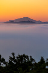 Mountains of the La Rhune Range Emerging from a Sea of Clouds at Sunrise in Sare