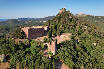 Aerial view of Monestir d'Escornalbou castle on sunny summer day. Riudecanyes, Tarragona, Spain.