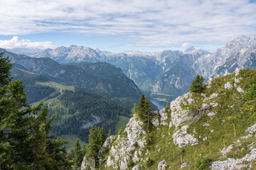 Beautiful mountain landscape in Germany with grey mountains, partly covered with forest the sky is...