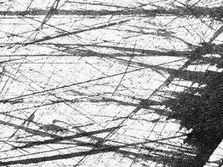 Abstract black and white texture with overlapping lines on a light background creating a dynamic...
