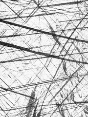 Obraz premium Abstract monochrome texture with chaotic black lines on a white background captured in a minimalistic style