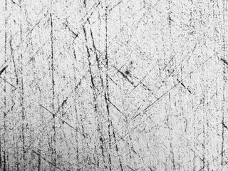 Abstract texture of scratched surface captured in black and white