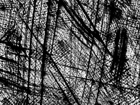 Abstract black and white textures formed by intricate lines and patterns in a dynamic design