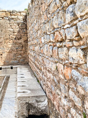 The bath house and toilet of the Ancient Greece Greek and the Roman Empire, the ruins site of Ephesus and Library of Celsus, Izmir, Turkiye