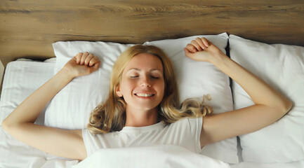 Woman sleeping lying in bed on white soft comfortable pillow in bedroom at home