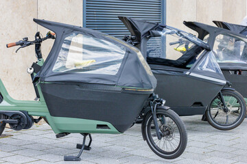 Row of Dutch electric cargo bikes in Amsterdam