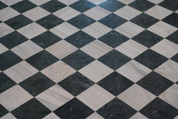 Tile pattern in Zamora, Castilla y León showing a contrasting checkered design of black and white...