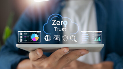 Hand holding tablet with zero trust cloud icon and cybersecurity dashboard. Concept of cloud data...