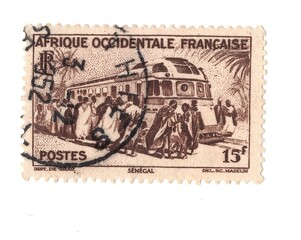 A vintage postage stamp from French West Africa isolated on a white background.