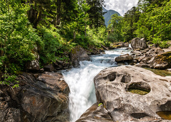 The Gave de Marcadau river flows over the Cascade du Pas de l'Ours in the Val de Jeret in the French Pyrenees