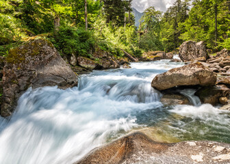 The Gave de Marcadau river flows over the Cascade du Pas de l'Ours in the Val de Jeret in the French Pyrenees