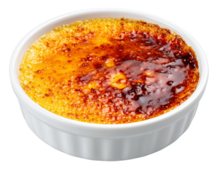 Creamy creme brulee featuring crisp caramelized surface, revealing smooth custard with golden brown glaze