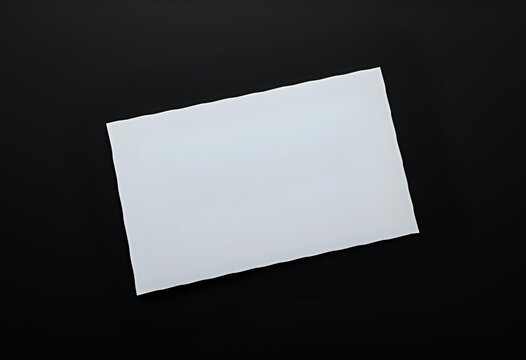 A blank business card mockup lying flat on black background, sharp edges, top-down view, ideal for personal branding or minimalist identity design.